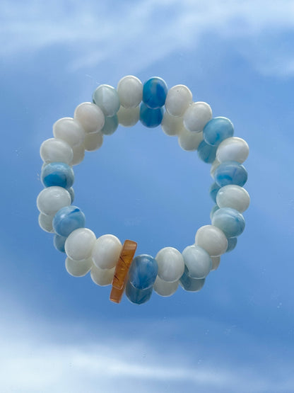 Bracelet with ocean plastic and recycled amber